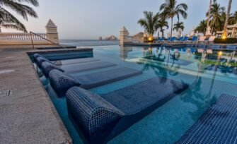 blue-sun-loungers-swimming-pool_198523-20 Creative Pool Upgrade Ideas: 8 Ways to Enhance Your Swimming Pool